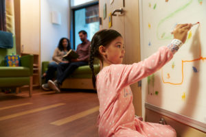 Girl drawing in patient room